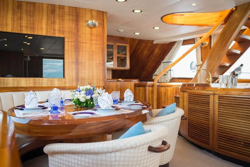 a kitchen with a dining table aboard GOLDEN OSPREY Yacht for Sale