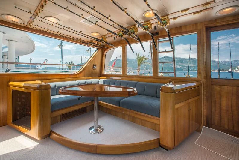 a room with a couch and a table aboard GOLDEN OSPREY Yacht for Sale