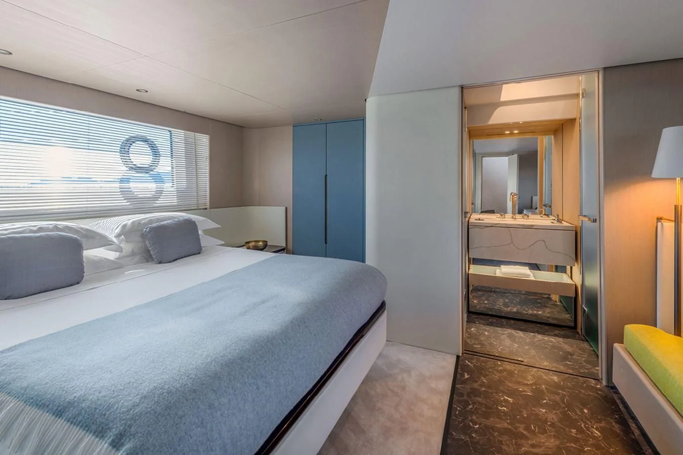 a bedroom with a bed and a desk aboard SUNSTROKE Yacht for Sale