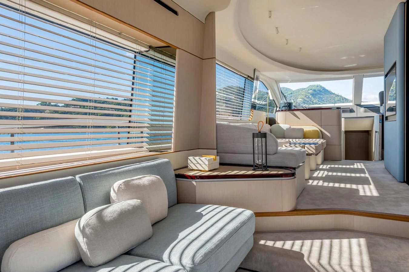 a living room with a large window aboard SUNSTROKE Yacht for Sale