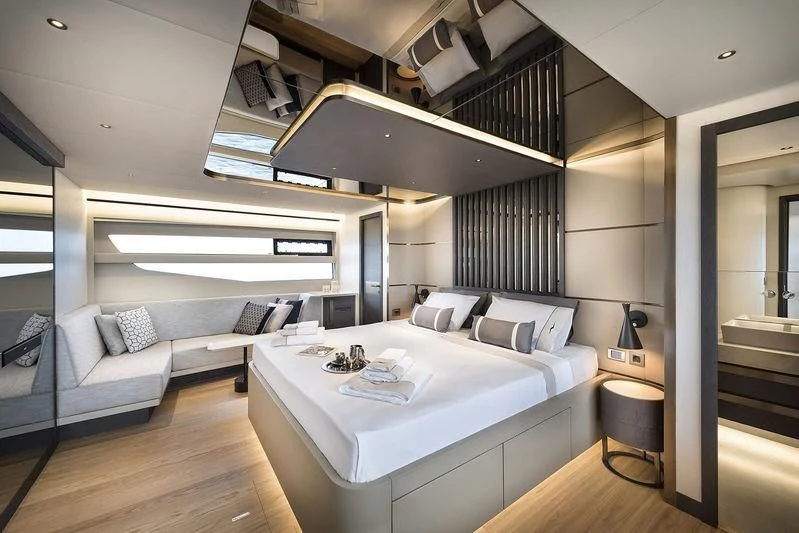 a room with a bed and a couch aboard GIOIA Yacht for Sale