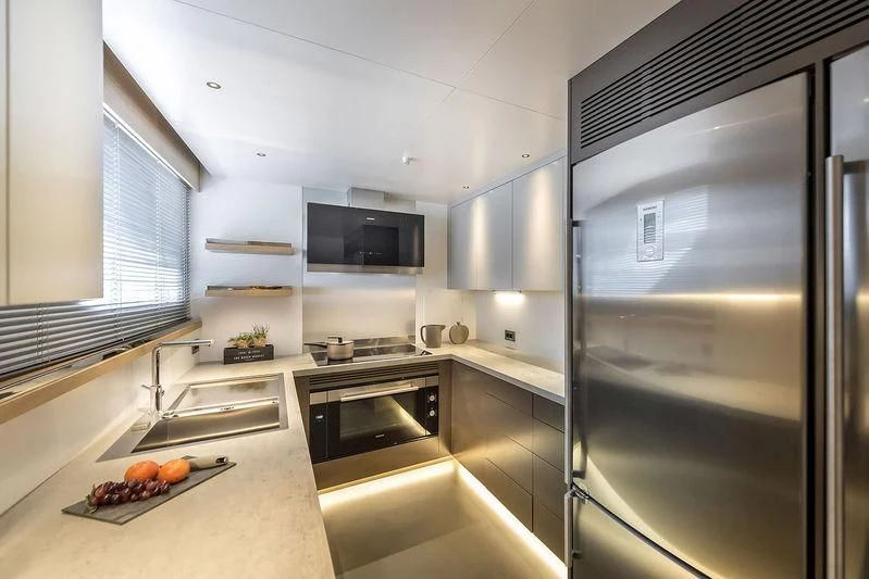 a kitchen with stainless steel appliances aboard GIOIA Yacht for Sale