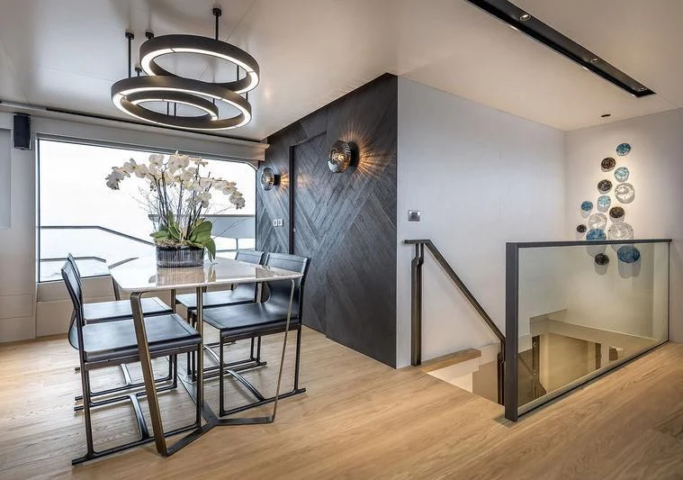 a dining room with a table and chairs aboard GIOIA Yacht for Sale