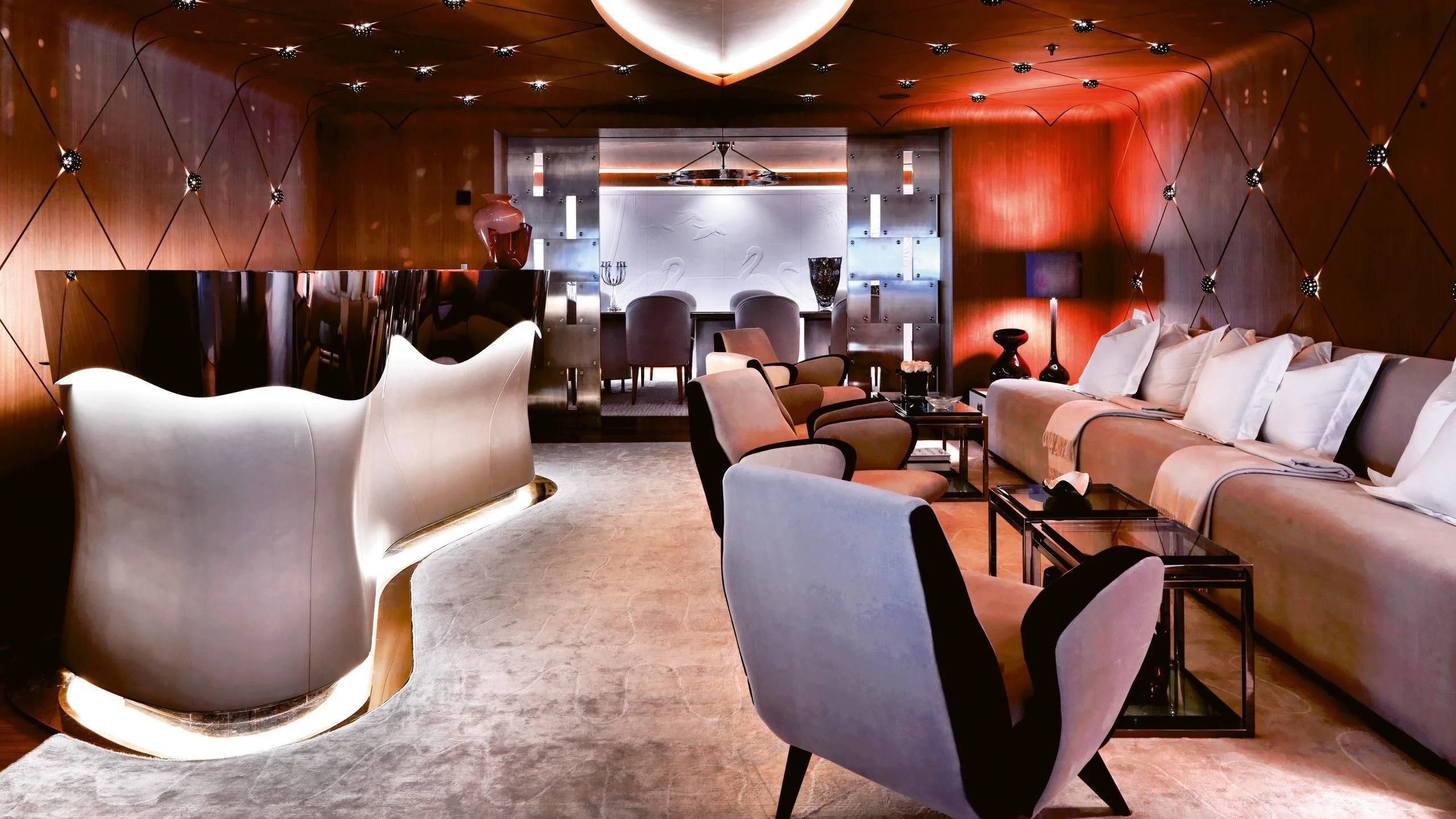 a room with couches and chairs aboard HIGH POWER III Yacht for Sale