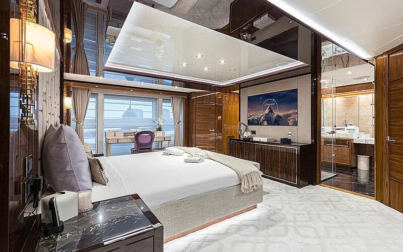 a bedroom with a large bed aboard THE BOAT OF FATE 2 Yacht for Sale