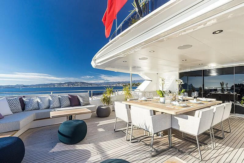 a table and chairs on a deck aboard THE BOAT OF FATE 2 Yacht for Sale