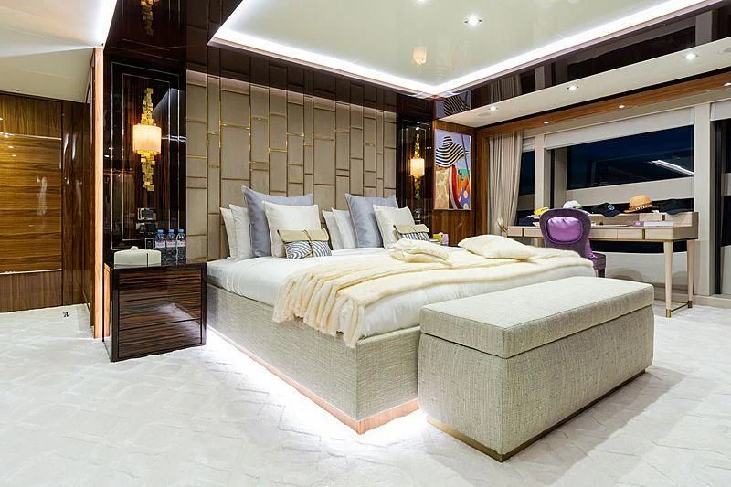 a large bedroom with a bed and a desk aboard THE BOAT OF FATE 2 Yacht for Sale