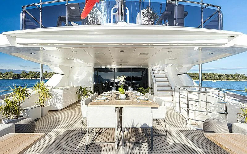 a room with a table and chairs aboard THE BOAT OF FATE 2 Yacht for Sale