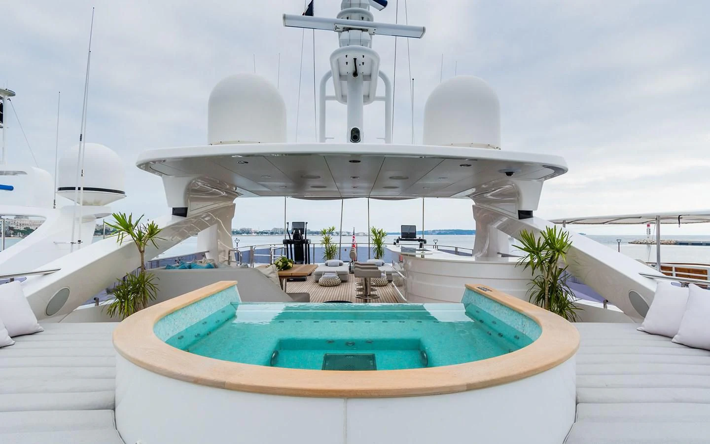 a pool with a building in the background aboard THE BOAT OF FATE 2 Yacht for Sale