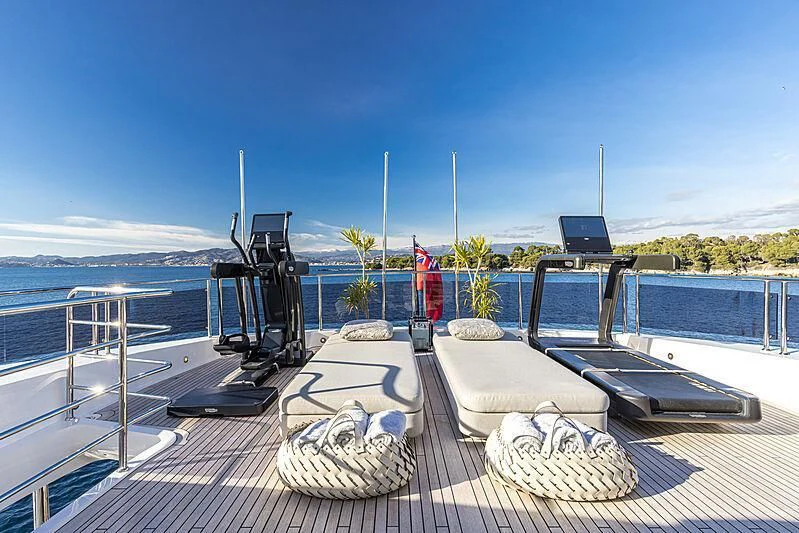 a deck with a chair and a table on it aboard THE BOAT OF FATE 2 Yacht for Sale