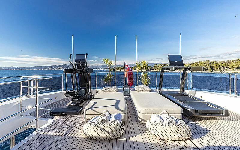 a deck with a large body of water and a boat on it aboard THE BOAT OF FATE 2 Yacht for Sale