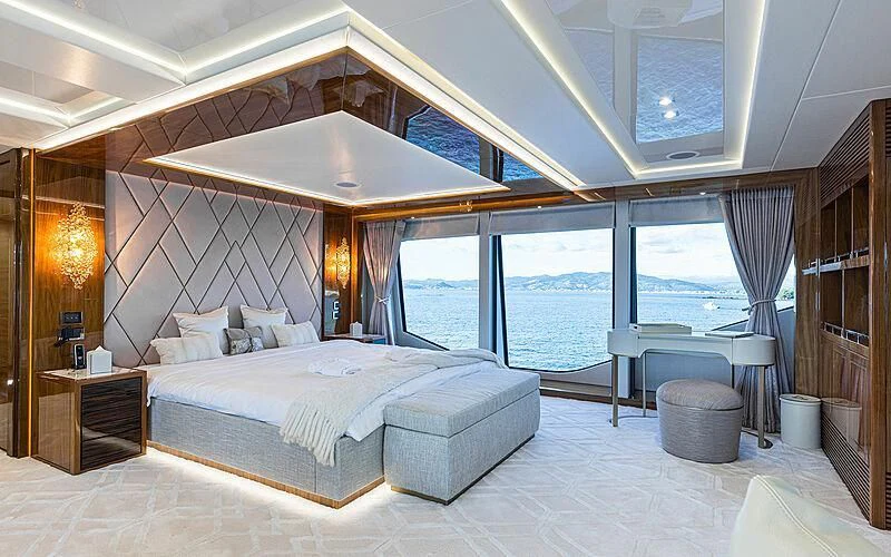 a large bedroom with a large bed aboard THE BOAT OF FATE 2 Yacht for Sale