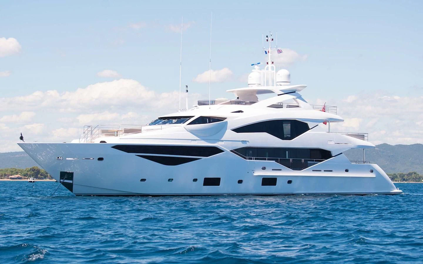 a white yacht on the water aboard THE BOAT OF FATE 2 Yacht for Sale