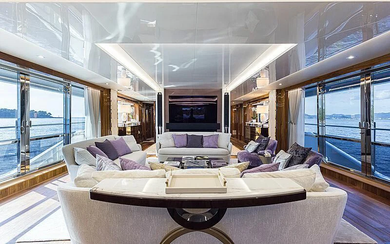 a living room with a large couch aboard THE BOAT OF FATE 2 Yacht for Sale