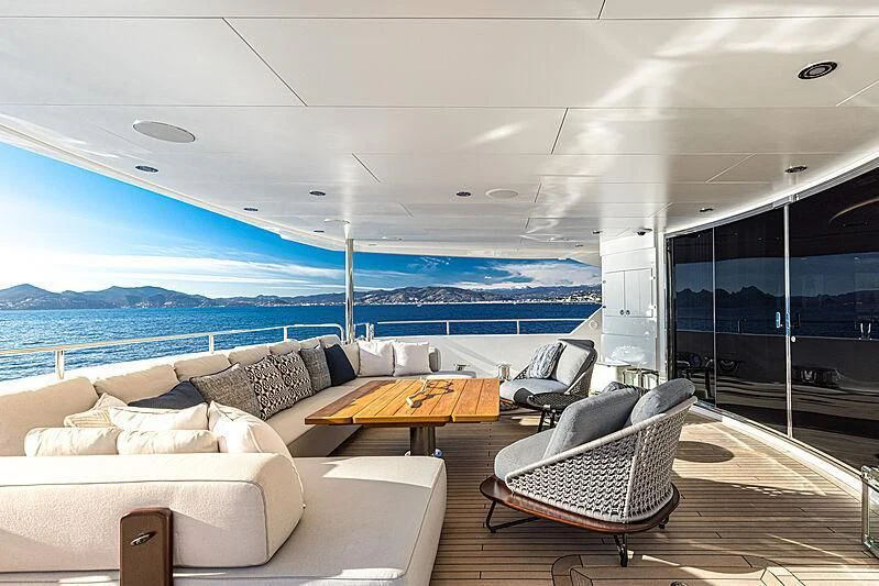 a room with a couch and a table and a view of the ocean aboard THE BOAT OF FATE 2 Yacht for Sale