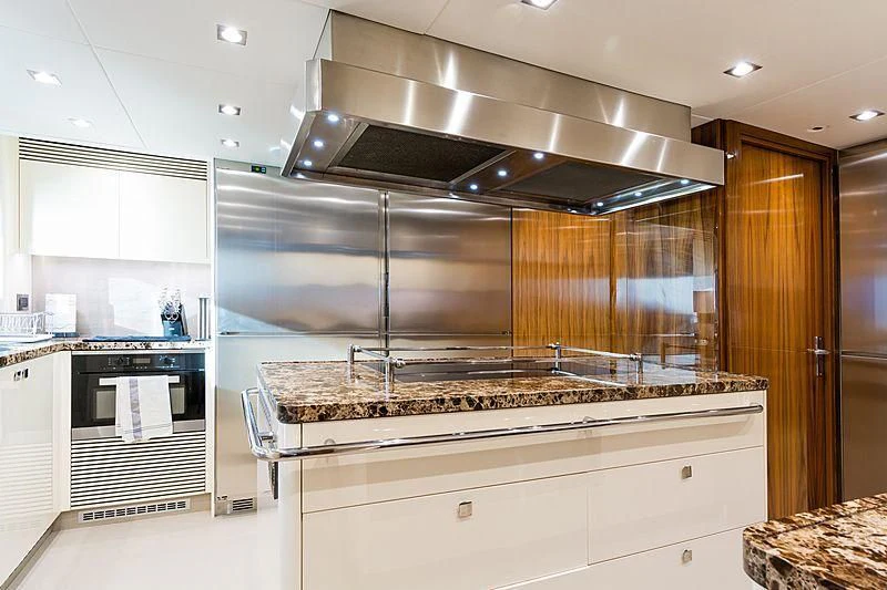 a kitchen with a stainless steel stove aboard THE BOAT OF FATE 2 Yacht for Sale