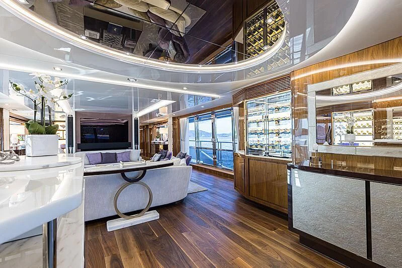 a room with a large window and a table with chairs aboard THE BOAT OF FATE 2 Yacht for Sale