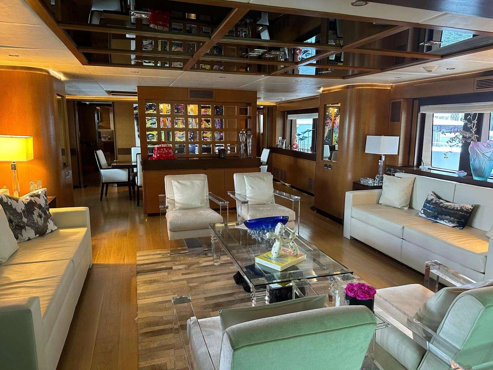 a living room with a large mirror aboard KIMBERLIE Yacht for Sale