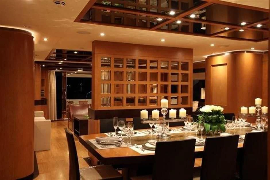 a large table with candles and flowers aboard KIMBERLIE Yacht for Sale