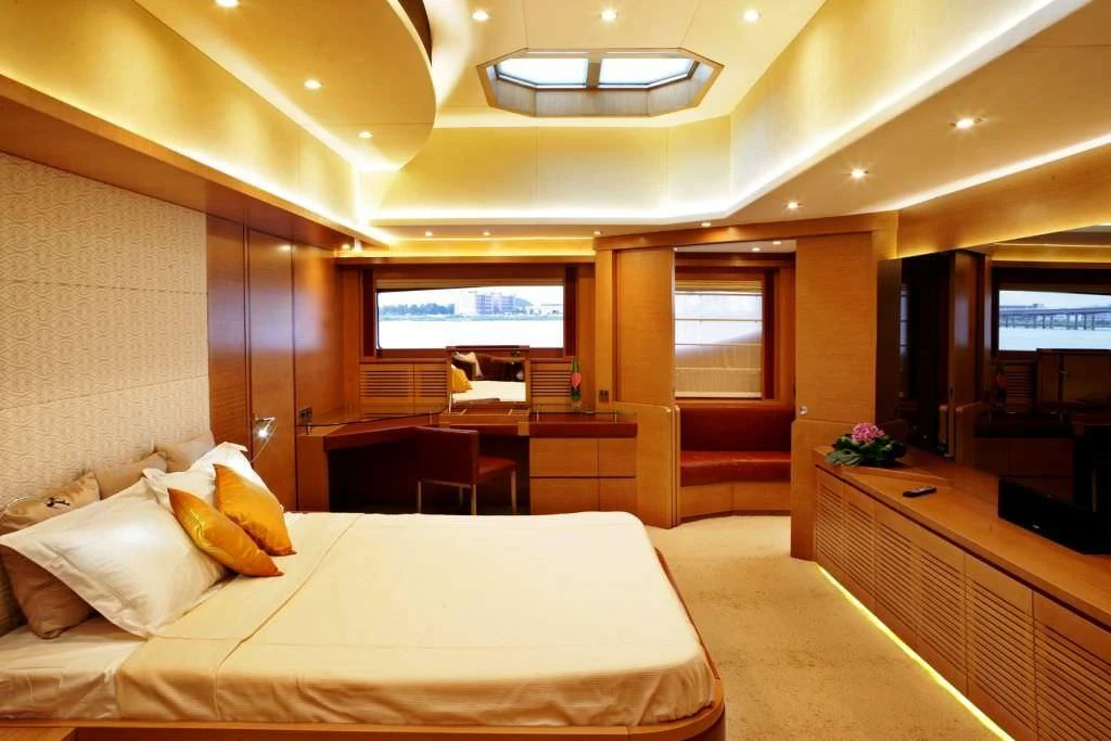 a hotel room with a bed and a table aboard KIMBERLIE Yacht for Sale
