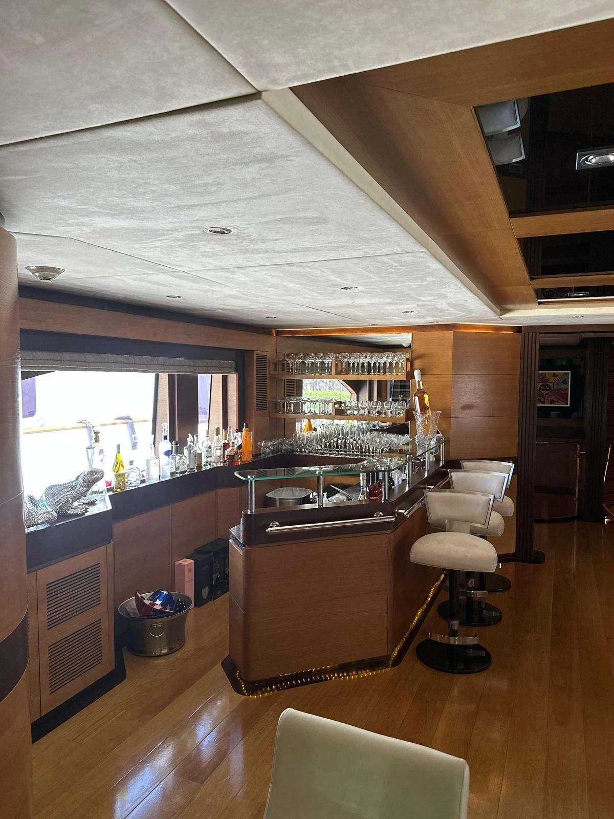 a kitchen with a bar and a bar aboard KIMBERLIE Yacht for Sale