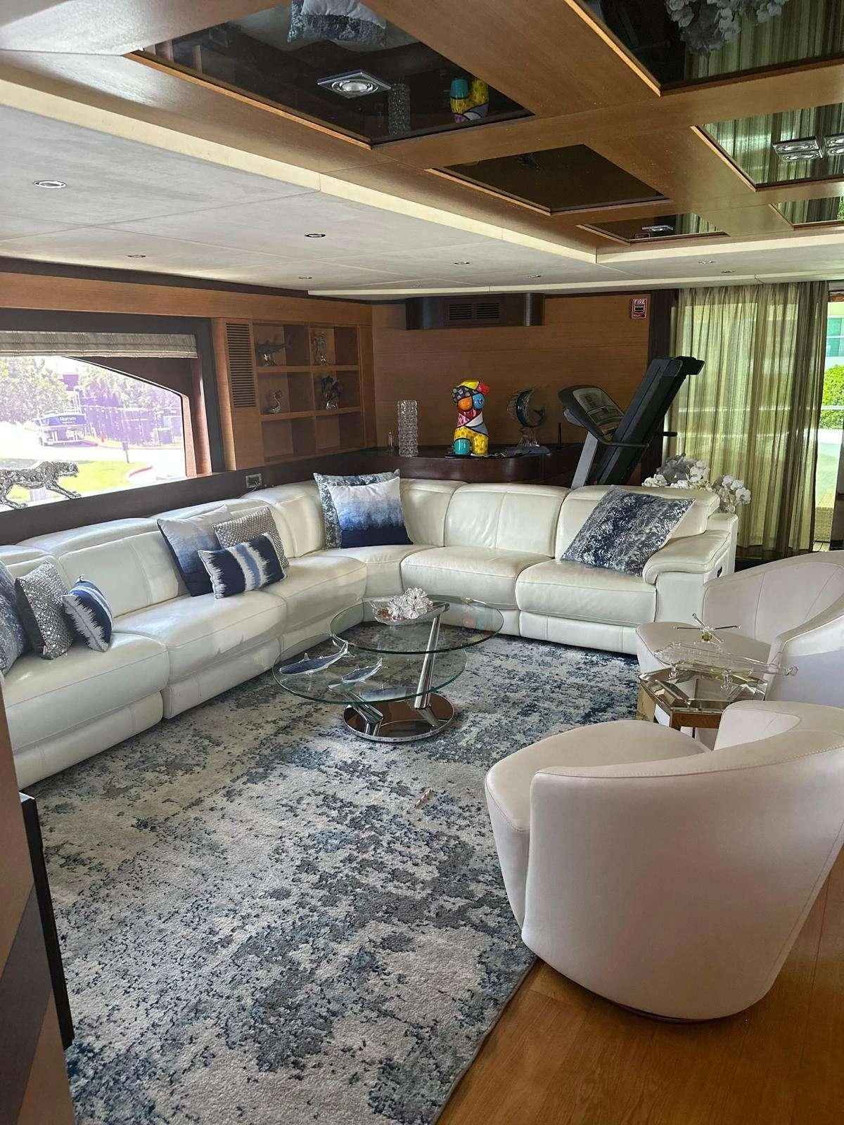 a living room with a large window aboard KIMBERLIE Yacht for Sale