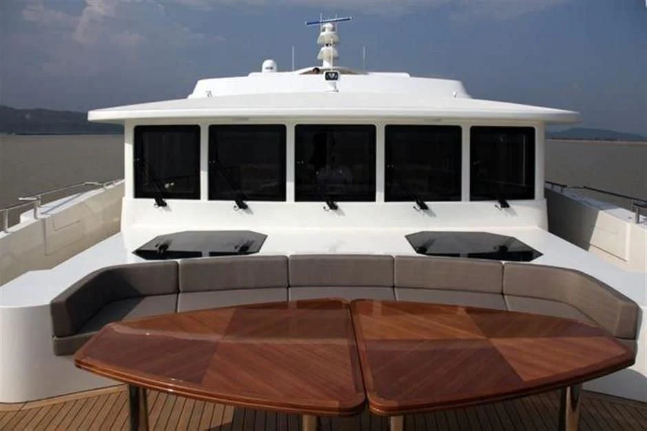 a room with a table and chairs aboard KIMBERLIE Yacht for Sale