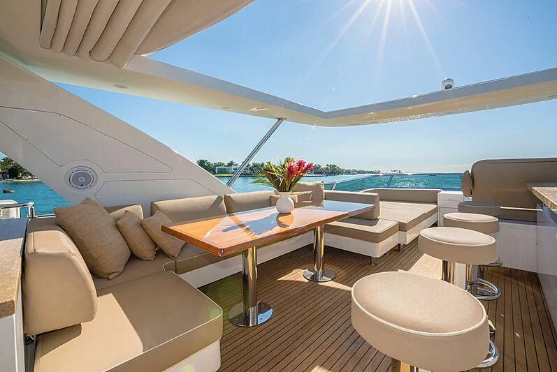 a room with a table and chairs aboard PHOENIX Yacht for Sale