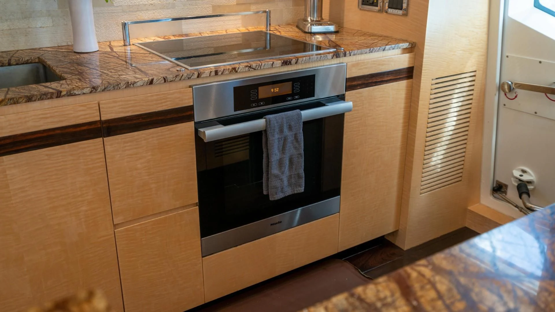 a kitchen with a stove and oven aboard PHOENIX Yacht for Sale
