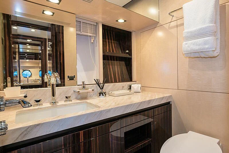 a bathroom with a large mirror aboard PHOENIX Yacht for Sale