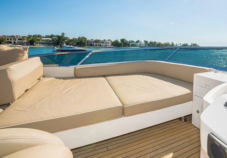 a pool with a deck and a deck and a building in the background aboard PHOENIX Yacht for Sale