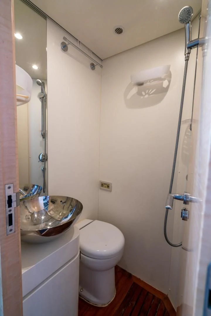 a bathroom with a sink and a toilet aboard PHOENIX Yacht for Sale