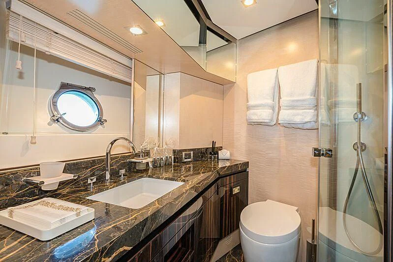 a bathroom with a large mirror aboard PHOENIX Yacht for Sale