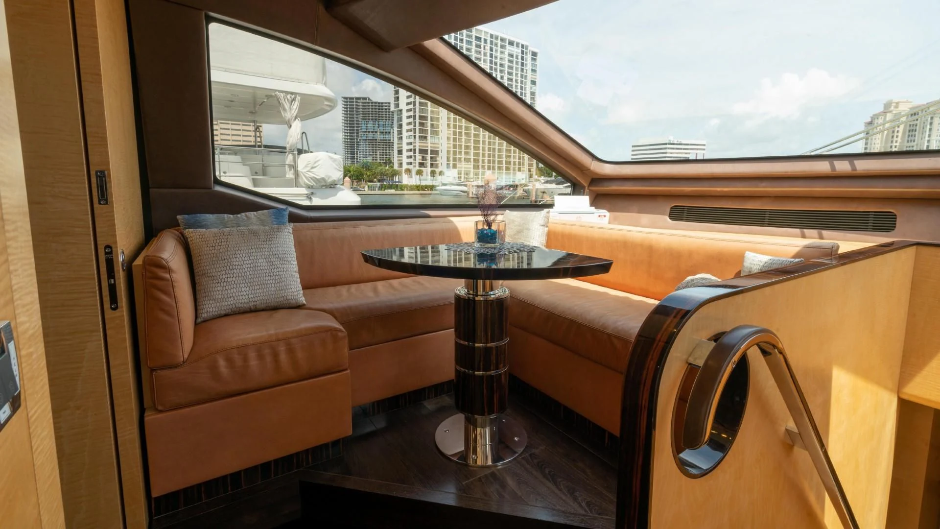 a table and chairs in a room aboard PHOENIX Yacht for Sale