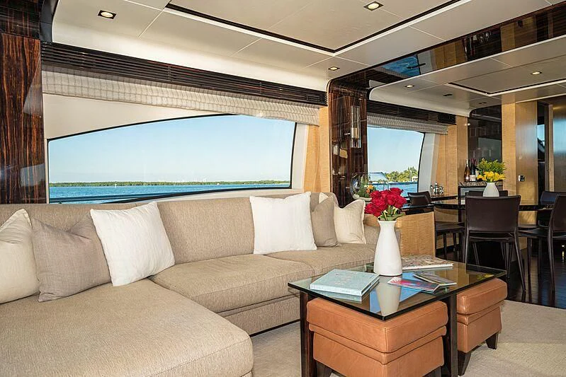 a living room with a large screen aboard PHOENIX Yacht for Sale