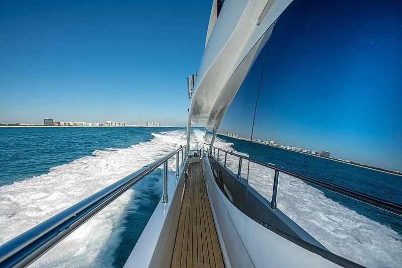a long wooden bridge over water aboard PHOENIX Yacht for Sale