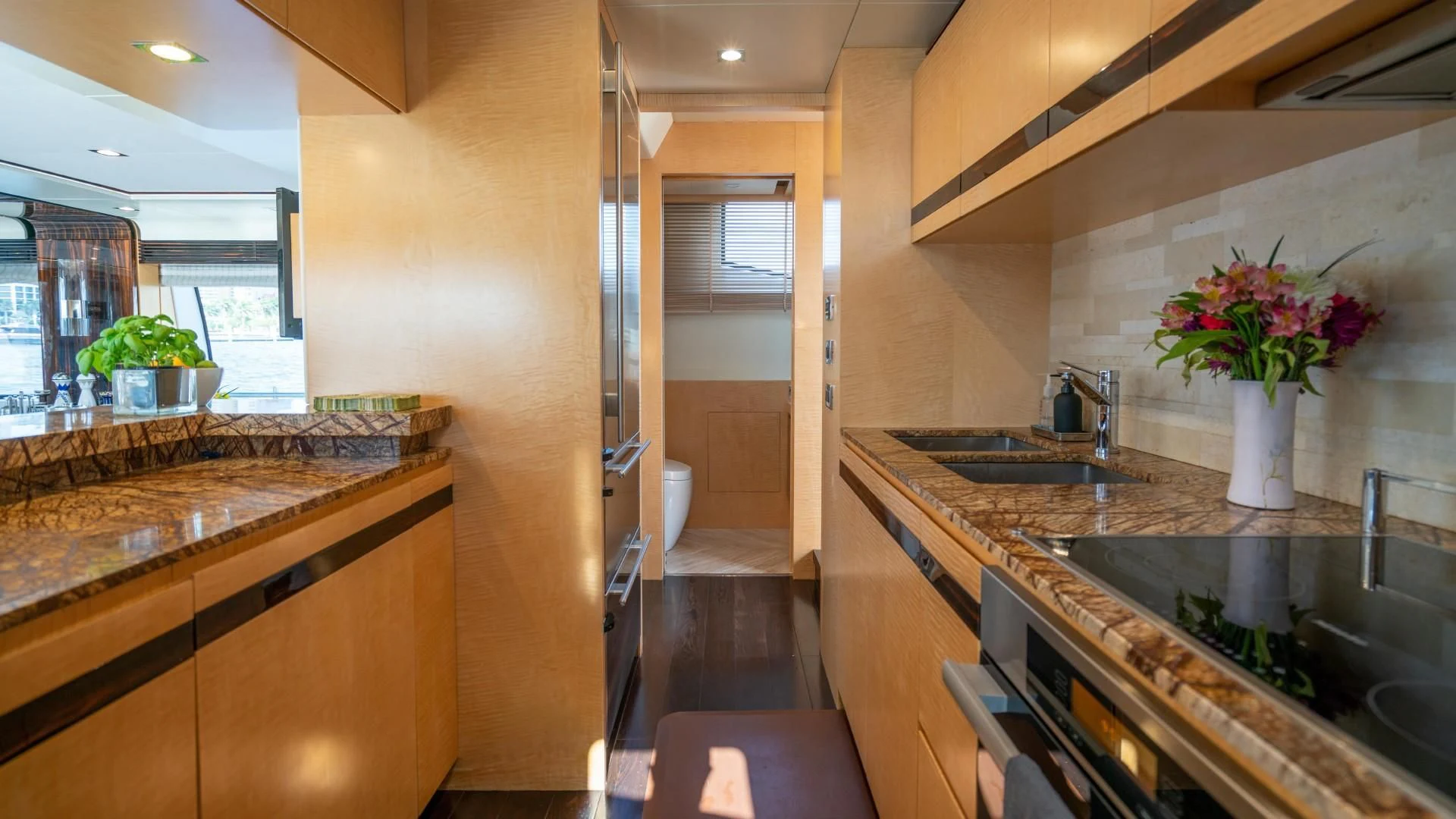 a kitchen with marble counters aboard PHOENIX Yacht for Sale