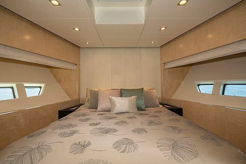 a bed with pillows aboard PHOENIX Yacht for Sale
