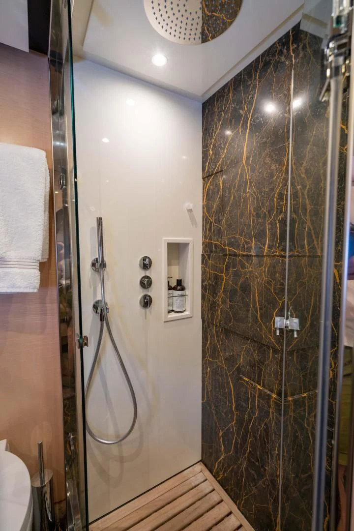 a shower with a glass door aboard PHOENIX Yacht for Sale