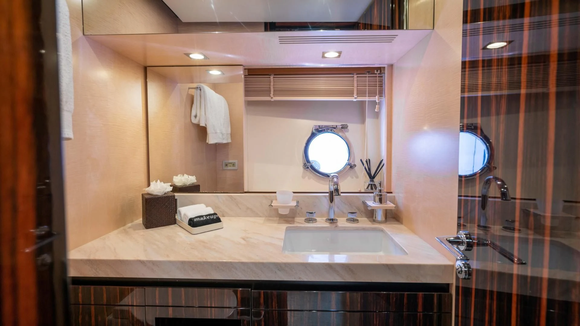 a bathroom with a large mirror aboard PHOENIX Yacht for Sale