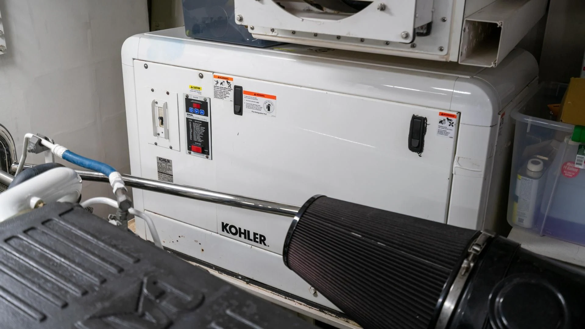 a white machine with a blue cable aboard PHOENIX Yacht for Sale