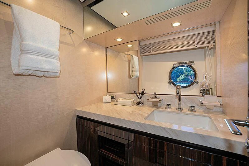 a bathroom with a large mirror aboard PHOENIX Yacht for Sale