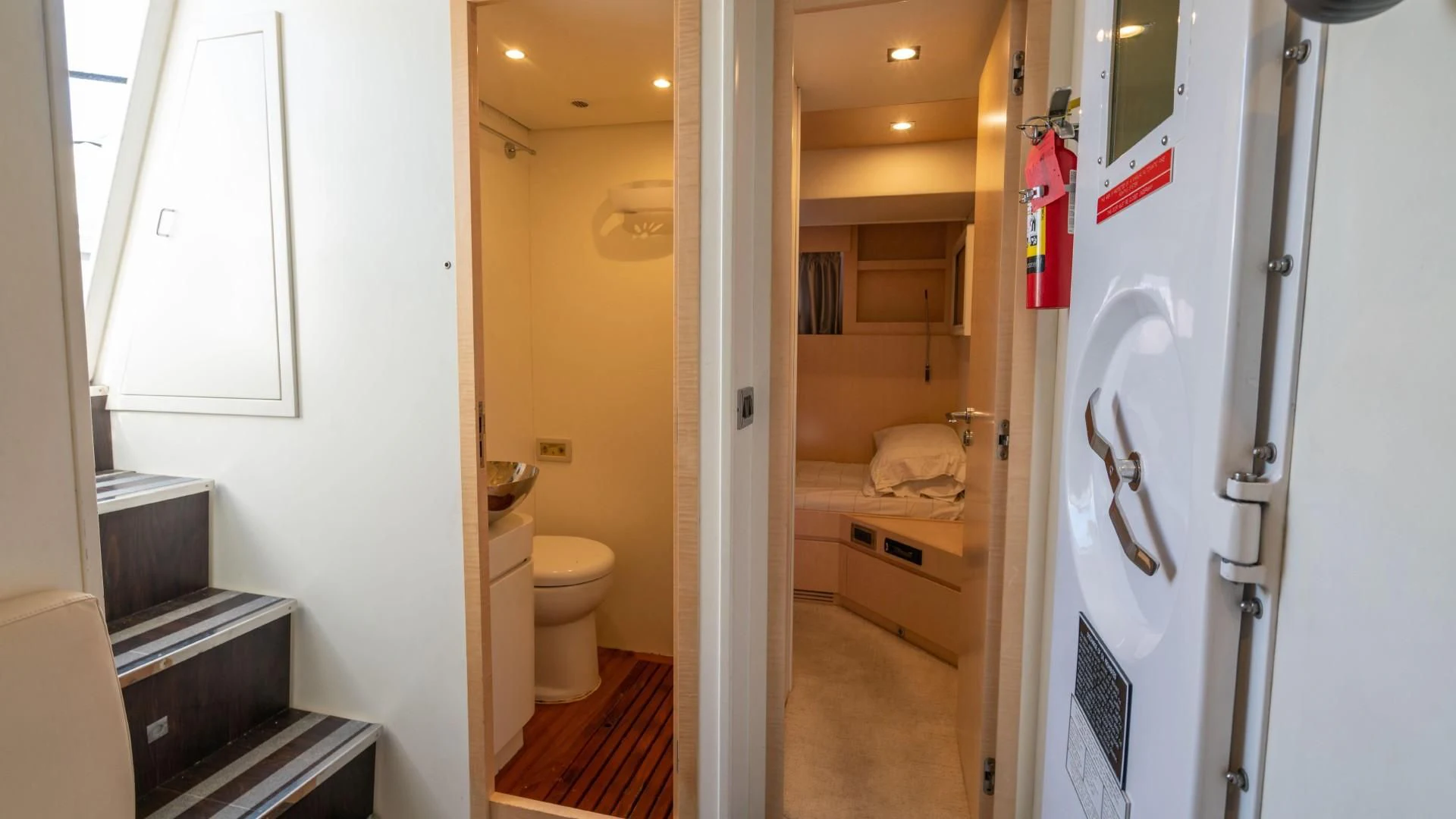 a bathroom with a toilet and a sink aboard PHOENIX Yacht for Sale