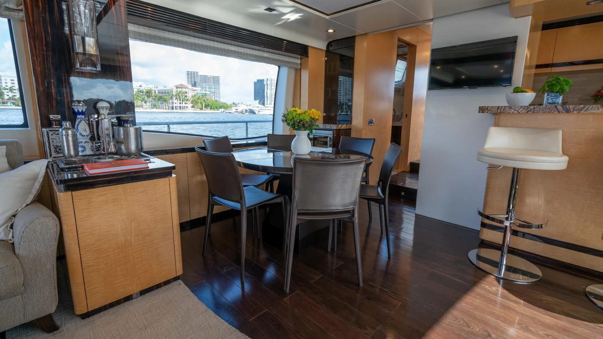 a room with a table and chairs aboard PHOENIX Yacht for Sale