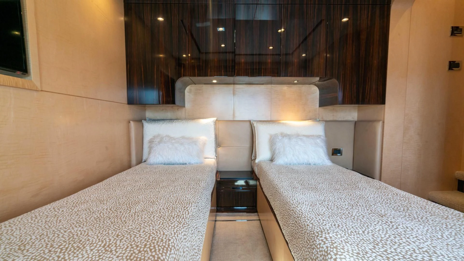 a room with a bed and a chair aboard PHOENIX Yacht for Sale