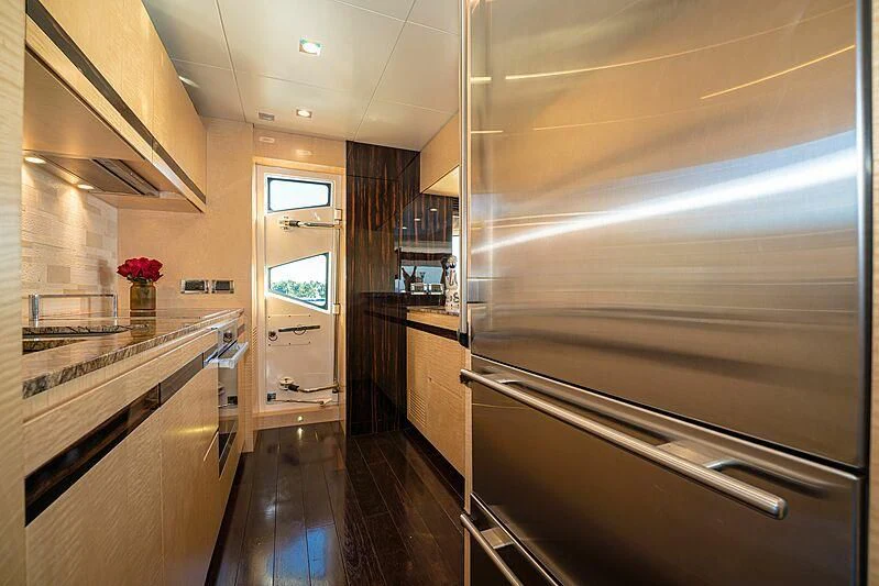a kitchen with a large glass shower aboard PHOENIX Yacht for Sale
