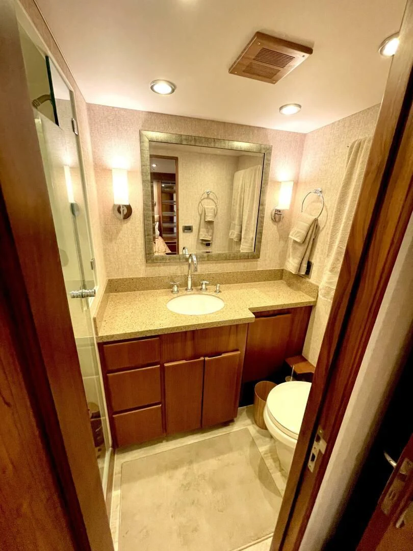 a bathroom with a sink and a mirror aboard SEA LION Yacht for Sale