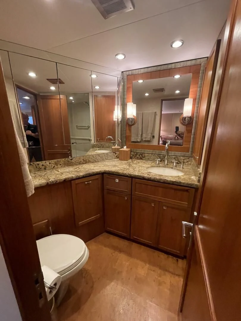 a bathroom with a large mirror aboard SEA LION Yacht for Sale