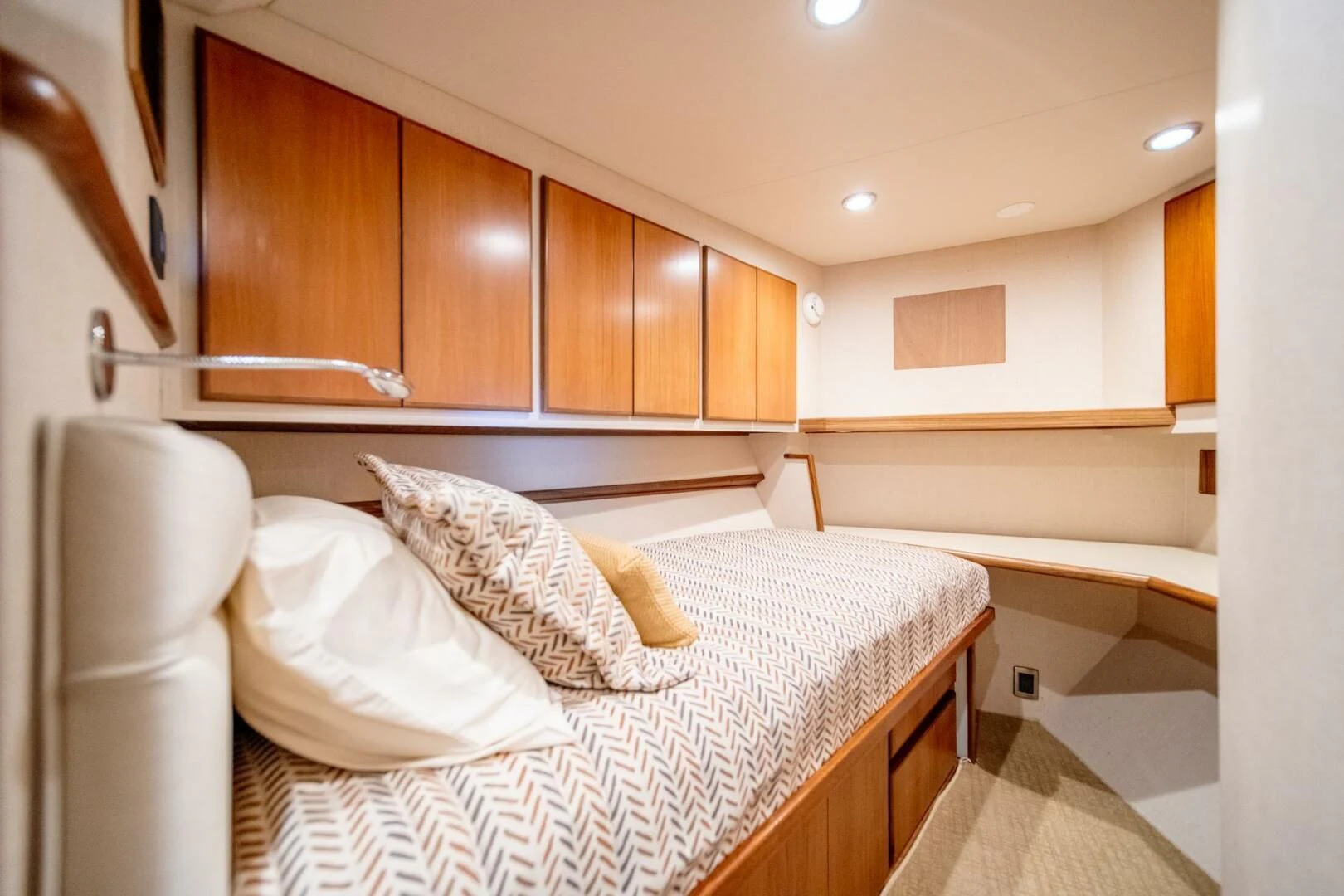 a room with a bed and cabinets aboard SEA LION Yacht for Sale