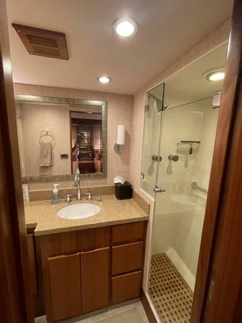 a bathroom with a sink and a mirror aboard SEA LION Yacht for Sale